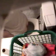 An overhead spycam is installed in a bathroom and captures four scenes of a woman using a toilet while farting, peeing, pooping, wiping herself, then flushing. The poop sounds are audible, and you can sometimes see the poop in the toilet before flushing.